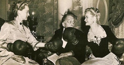 Director Edmund Goulding refereees a catfight bewteen Bette Davis and Miriam Hopkins during the filming of "The Old Maid"