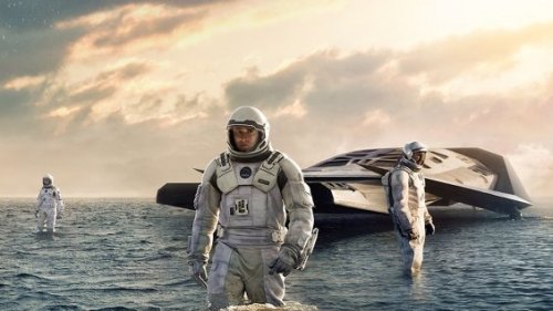 Matthew McConaughey (center) and colleagues explore a water planet